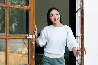 Woman standing in open door