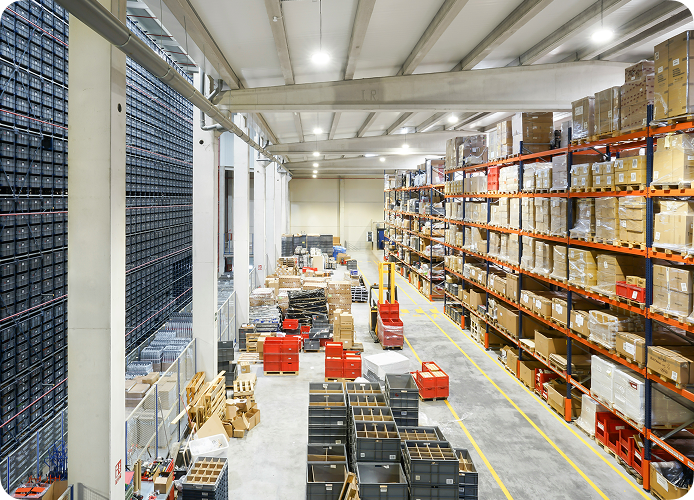 Commercial warehouse image with fork lifts and boxes