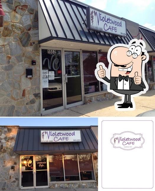 Violetwood Cafe storefront and logo with cartoon mascot.